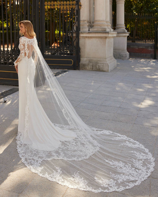 Romantic two-piece long mermaid wedding dress, crafted in crêpe combined with lace and beadwork.