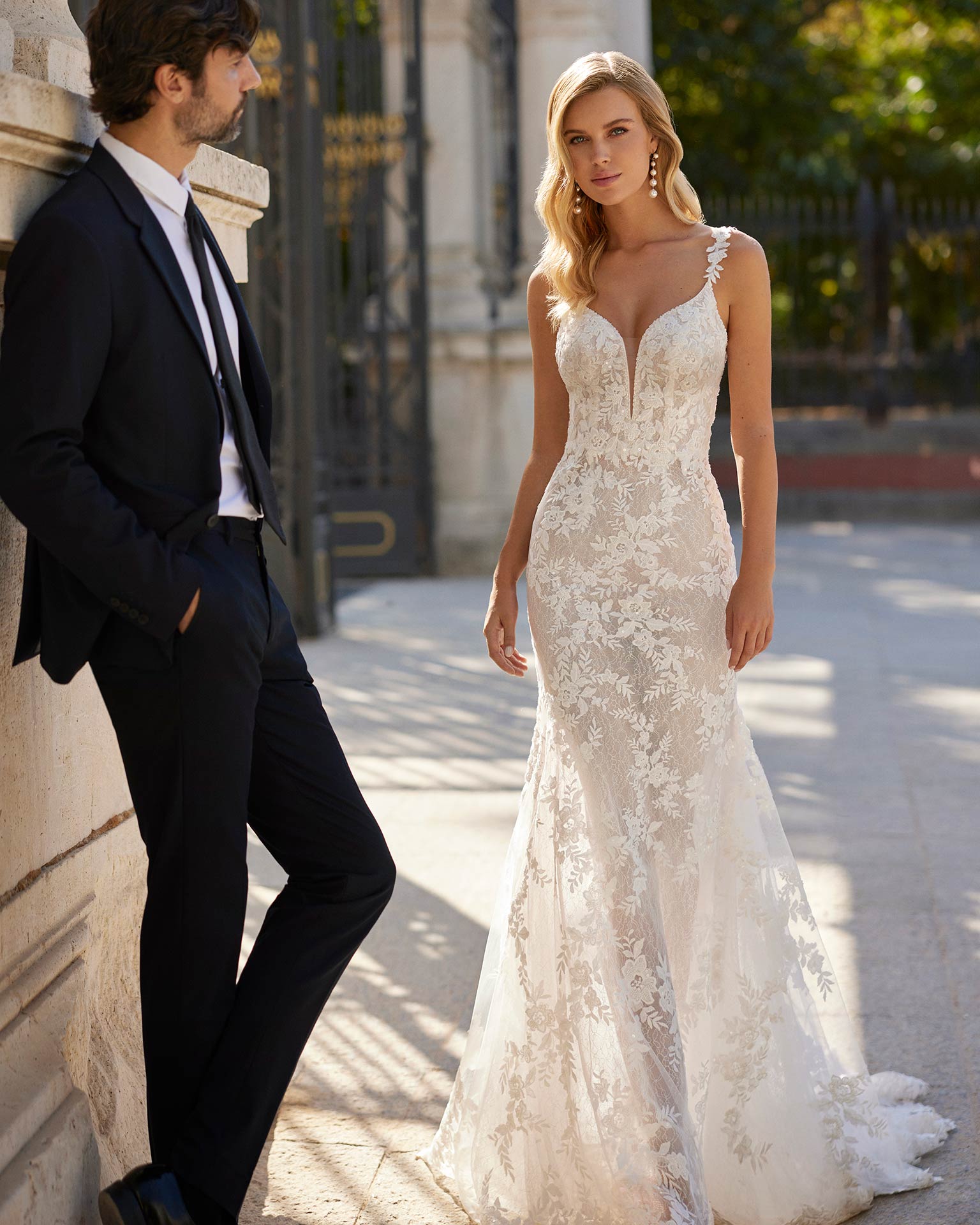 Sexy long mermaid wedding dress crafted in lace and beadwork. Showcase a V-neckline, plunging back and straps