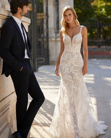 Sexy long mermaid wedding dress crafted in lace and beadwork. Showcase a V-neckline, plunging back and straps