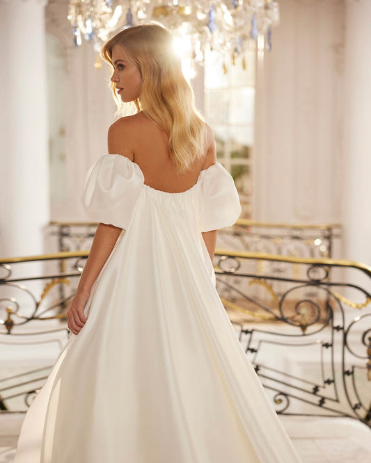 Classic two-piece long wedding dress crafted in verona mikado. A strapless neckline, closed back, detachable cuff neckline and side slit complete the look.