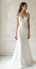 Elegant off-shoulder wedding dress with beaded detailing, open-back design, and flowing train