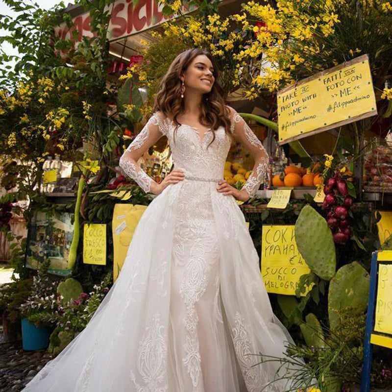 Luxury lace V-neck long sleeve mermaid detachable train bridal gown back view