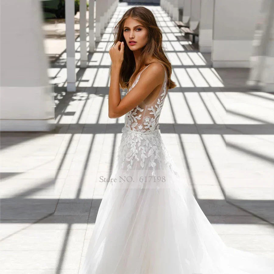 V-neck illusion lace applique tulle sexy sweep train backless bridal gown side view