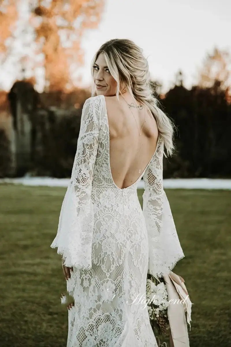 Lace vintage flare sleeves mermaid beach boho open back rustic bridal gown close-up