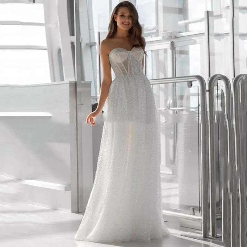 Sweetheart glitter tulle strapless corset sleeveless elegant A-line bridal gown front view