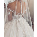 Long sleeves V-neck charming princess lace illusion buttons bride wedding gown side view