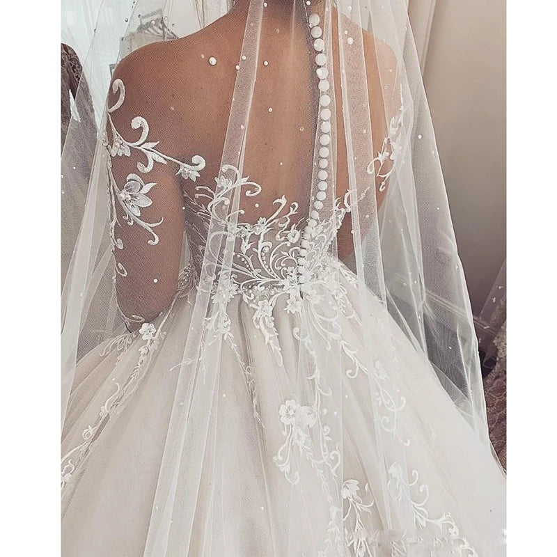 Long sleeves V-neck charming princess lace illusion buttons bride wedding gown side view