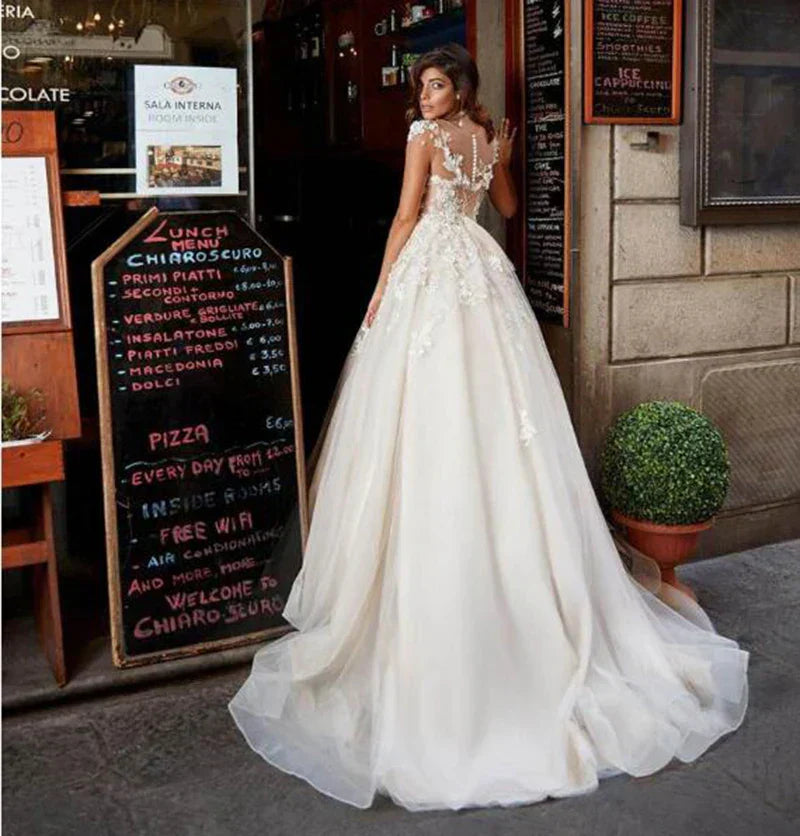 African princess ruffles lace A-line short sleeves tulle appliqued bridal gown back view