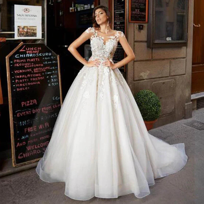 Tulle A-line short sleeves lace appliqued princess ruffles African bridal gown front view