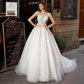 Tulle A-line short sleeves lace appliqued princess ruffles African bridal gown front view