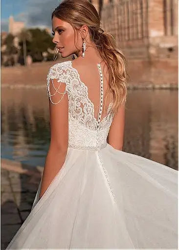 Graceful V-neck A-line tulle short sleeve illusion back appliques bridal gown front view