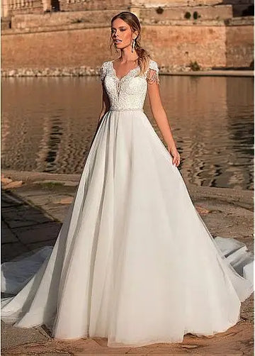 Graceful V-neck A-line tulle short sleeve illusion back appliques bridal gown front view
