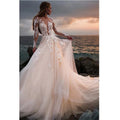 Long sleeve lace illusion train appliques ivory bridal gown side view