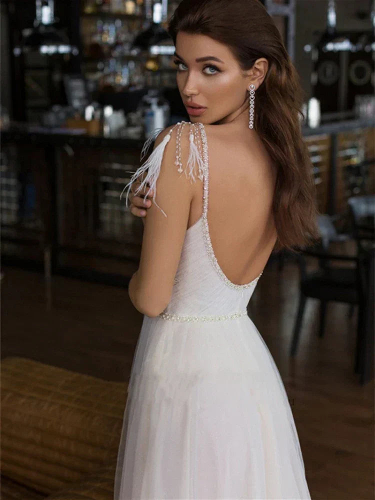 Beach backless V-neck spaghetti straps A-line tulle bridal gown back view