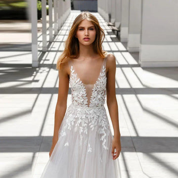 Sexy V-neck illusion applique lace tulle sweep train backless bridal gown front view