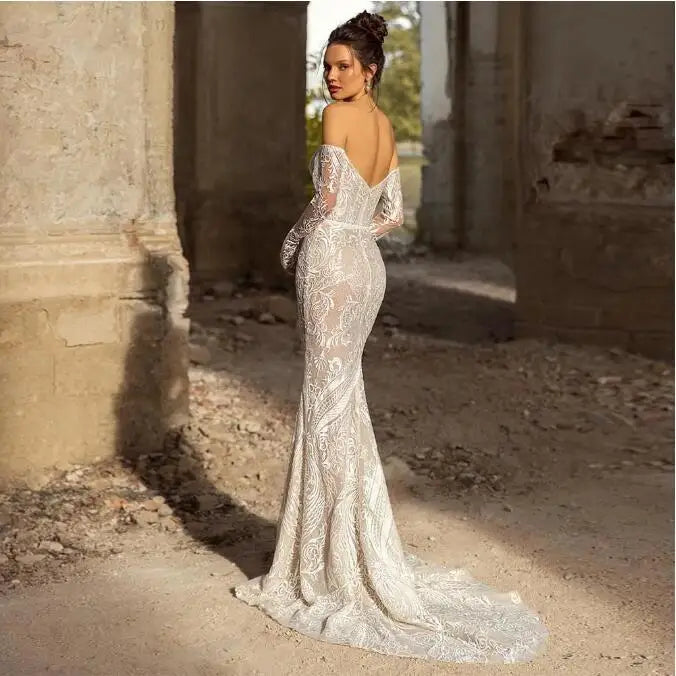 Off-shoulder strapless full sleeve A-line applique backless court train ivory wedding dress front
