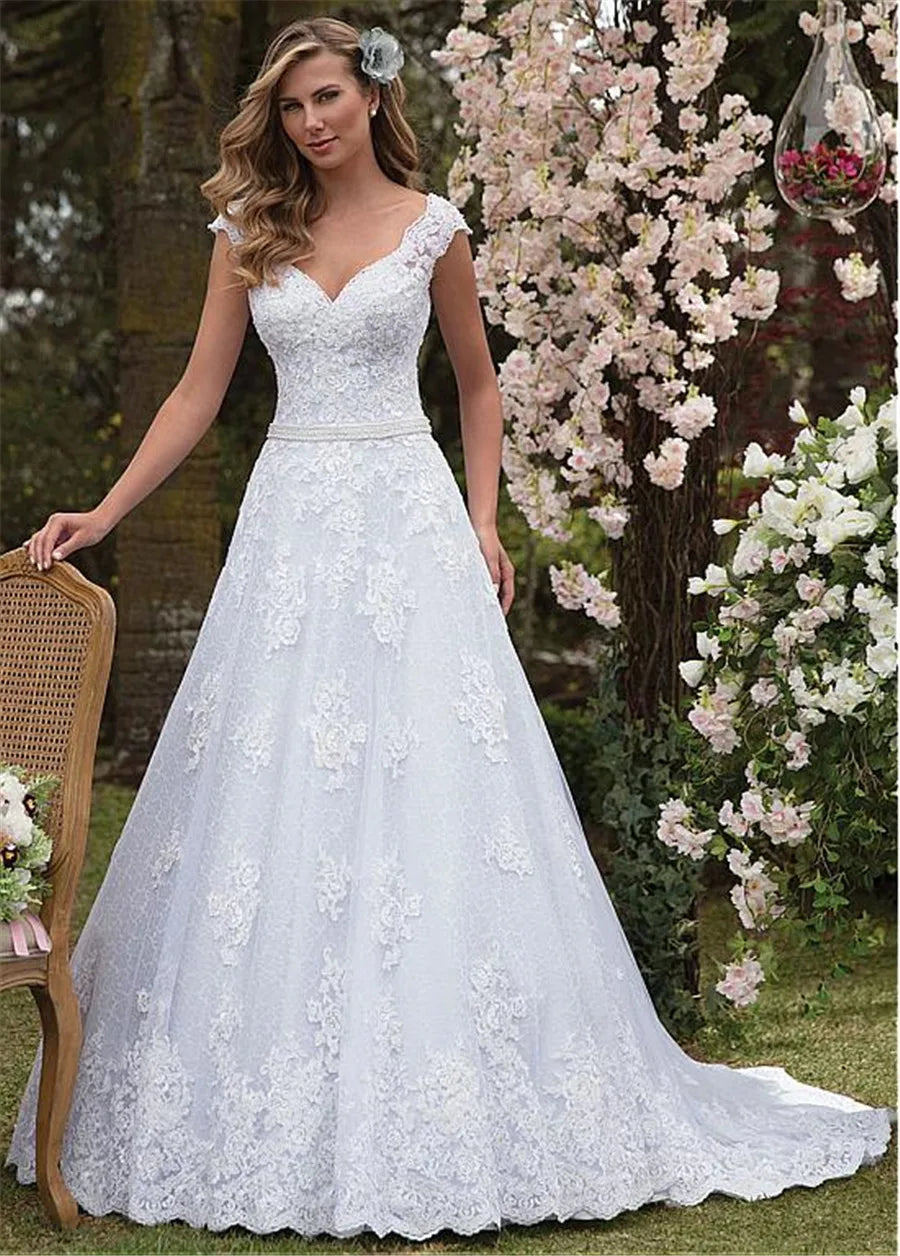 Elegant A-line wedding dress 2026 V-neck cap sleeves pearls sash lace applique tulle bridal gown