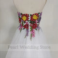 Backless sweep train tulle A-line strapless embroidery sleeveless floor length wedding dress back view