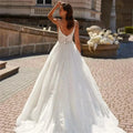 V-neck white lace wedding ceremony elegant women bridal gown front view