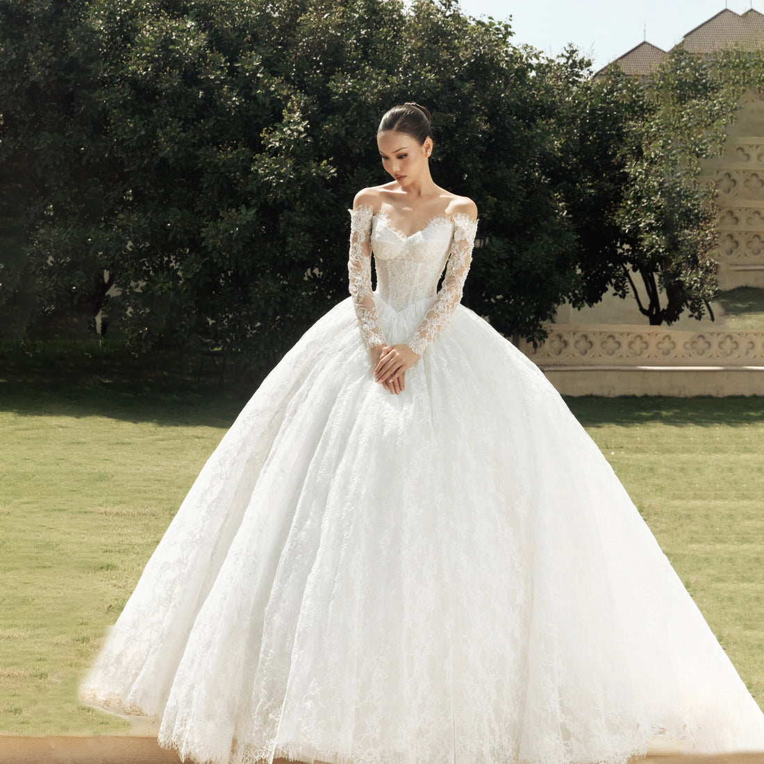 Off-shoulder long sleeve A-line lace wedding dress – front view – Snowy Bridal