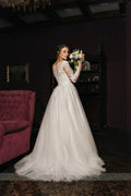 Round neck long sleeve A-line lace illusion button tulle skirt bridal party gown side view