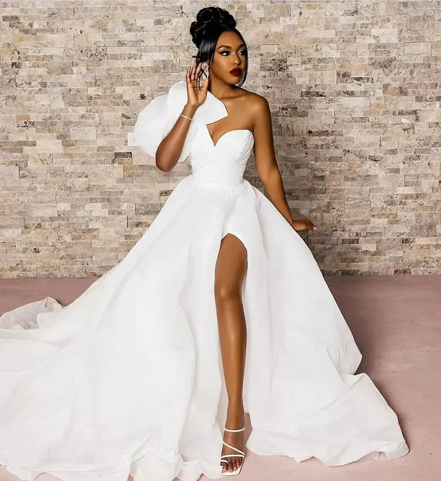 Single shoulder puff sleeve V-neck A-line beach side split big bow bridal dress front view