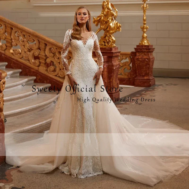 Mermaid O-neck beading full sleeve detachable train elegant bridal gown close-up