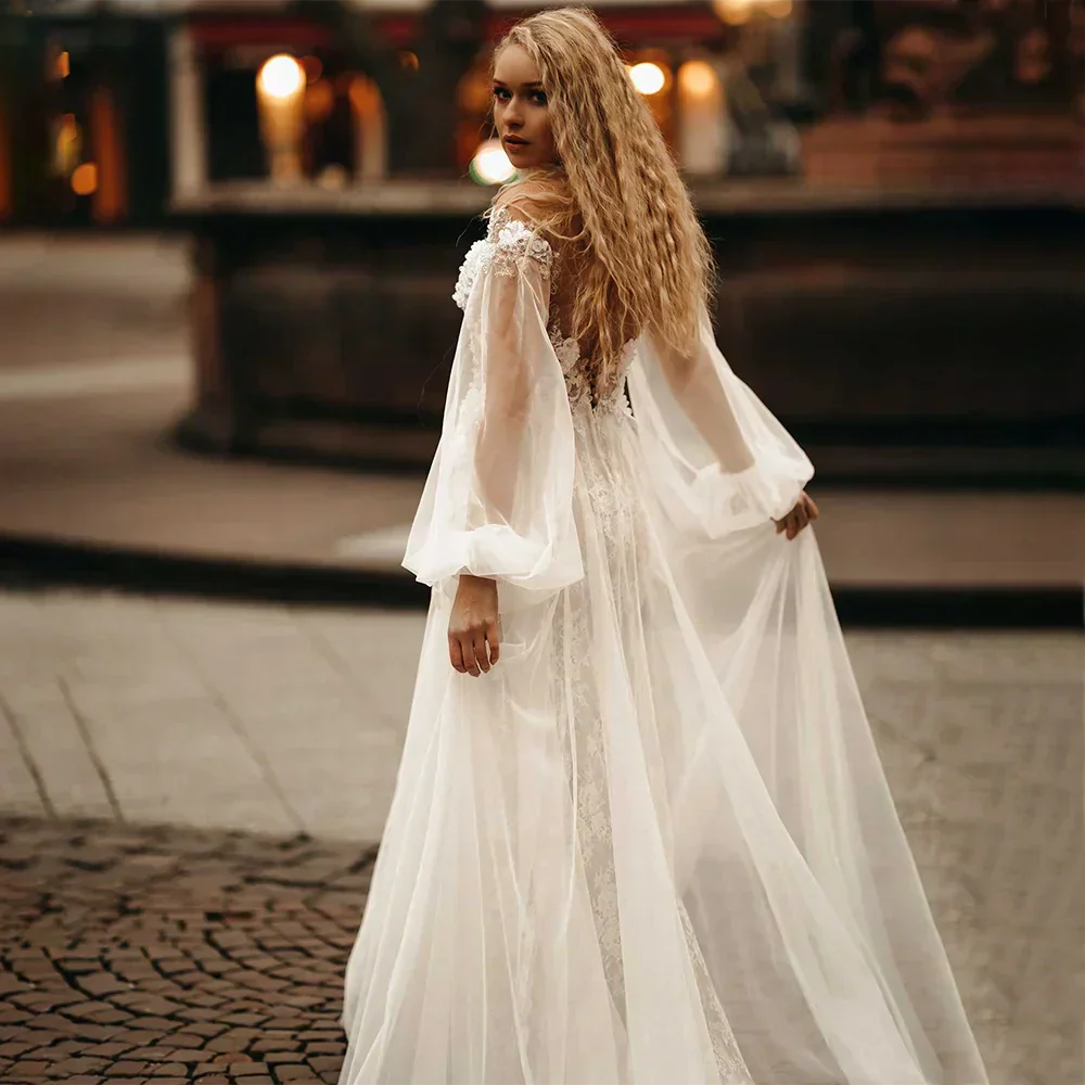 Lace backless V-neck puff sleeve A-line modern tulle sweep train bridal gown back view