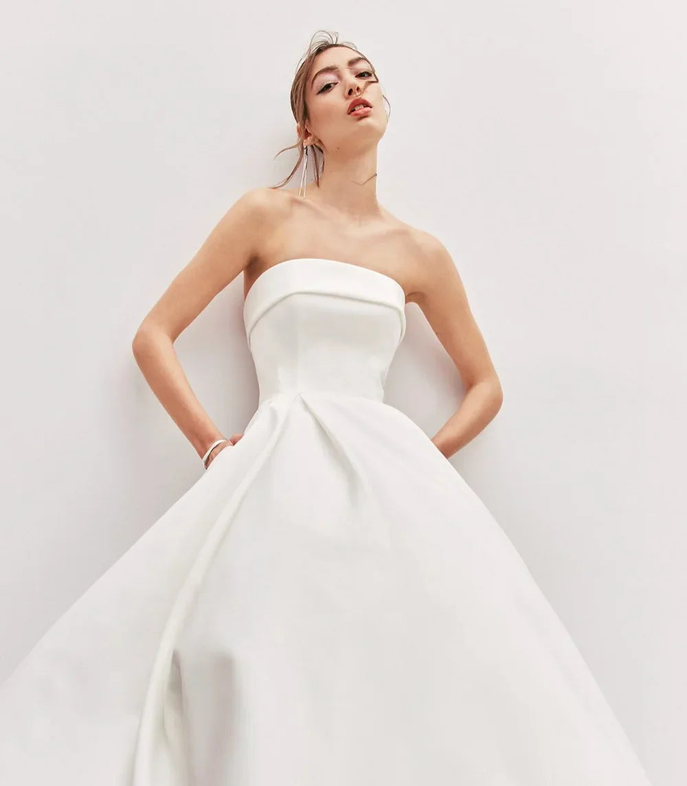 Strapless Satin Wedding Dresses With Pockets Backless Bow Court Train Brides Gown Modern Simple Bridal Dress Customized