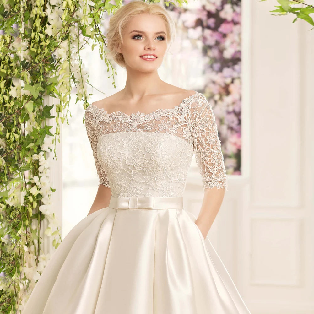 Boat neck half sleeve satin A-line wedding dress – back view – Snowy Bridal