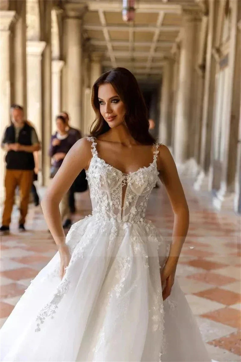 Sexy spaghetti straps sleeveless fluffy princess lace A-line white bridal gown front view