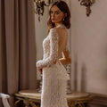 Long sleeve graceful mermaid scalloped neck embroidery detachable train wedding dress bridal gown side view