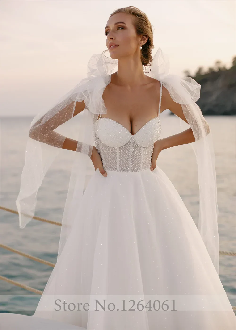 Sweetheart pleated sequins shiny spaghetti strap A-line bow court train bridal gown front view