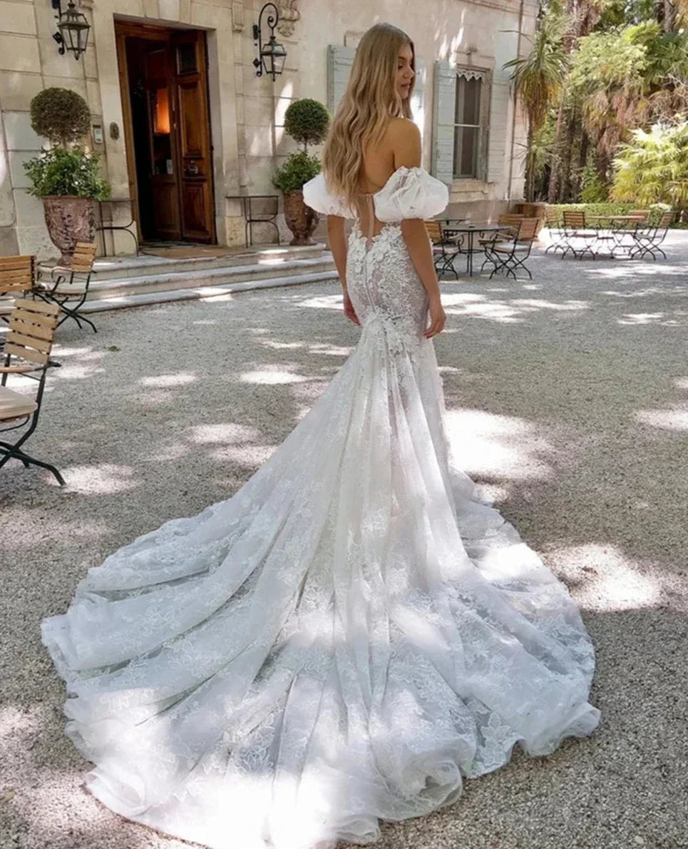 Illusion strapless romantic lace mermaid court train custom bridal gown back view