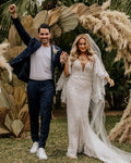 Lace V-back flared sleeve boho mermaid white beach bride gown back view