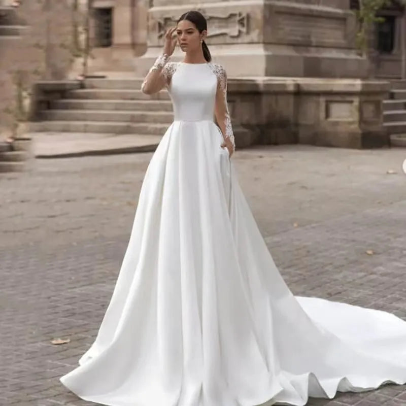 Exquisite A-line wedding dress 2026 boat neck long sleeves illusion back buttons embroidery lace bridal gown