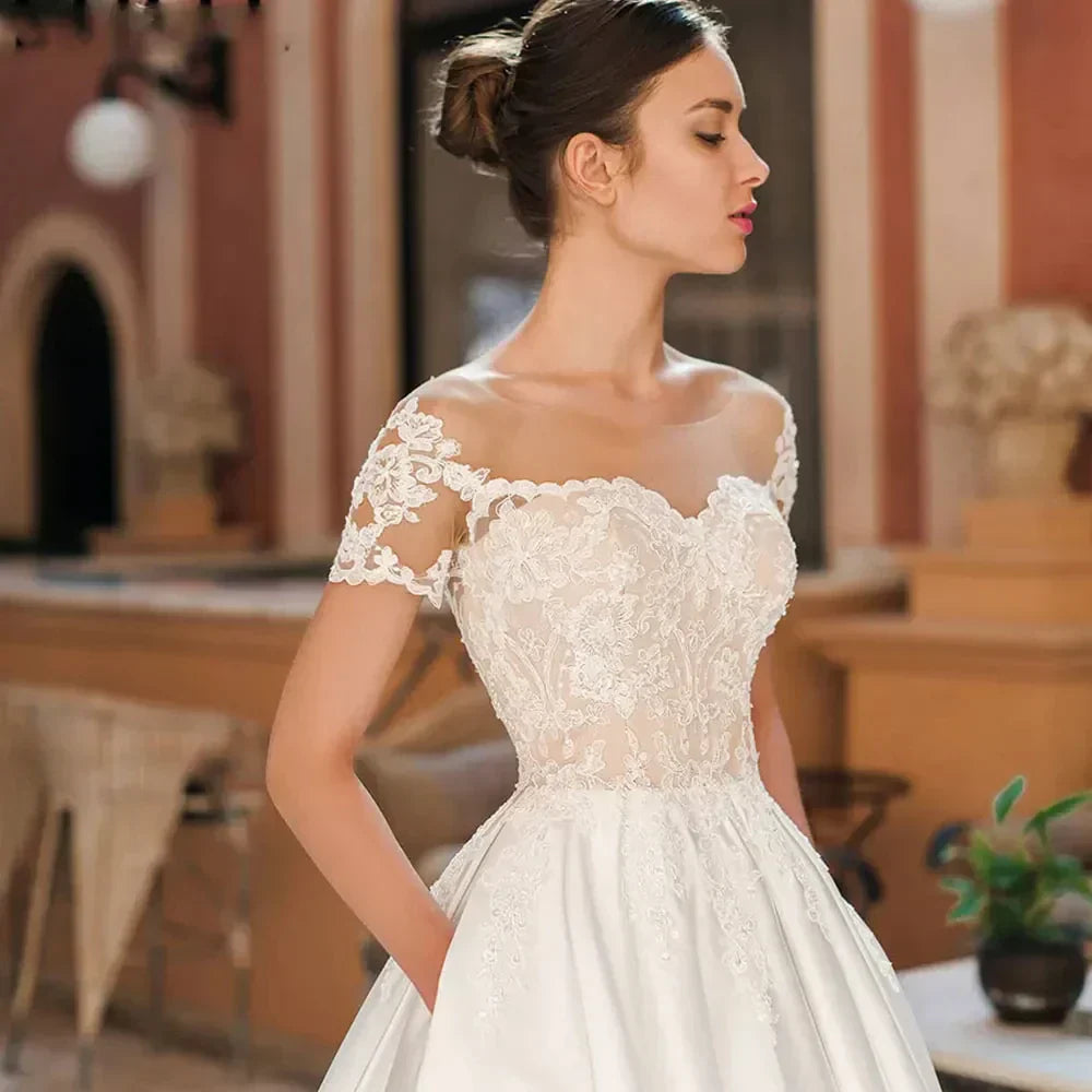 Sweetheart satin A-line appliques button backless off-shoulder floor length bridal gown front view