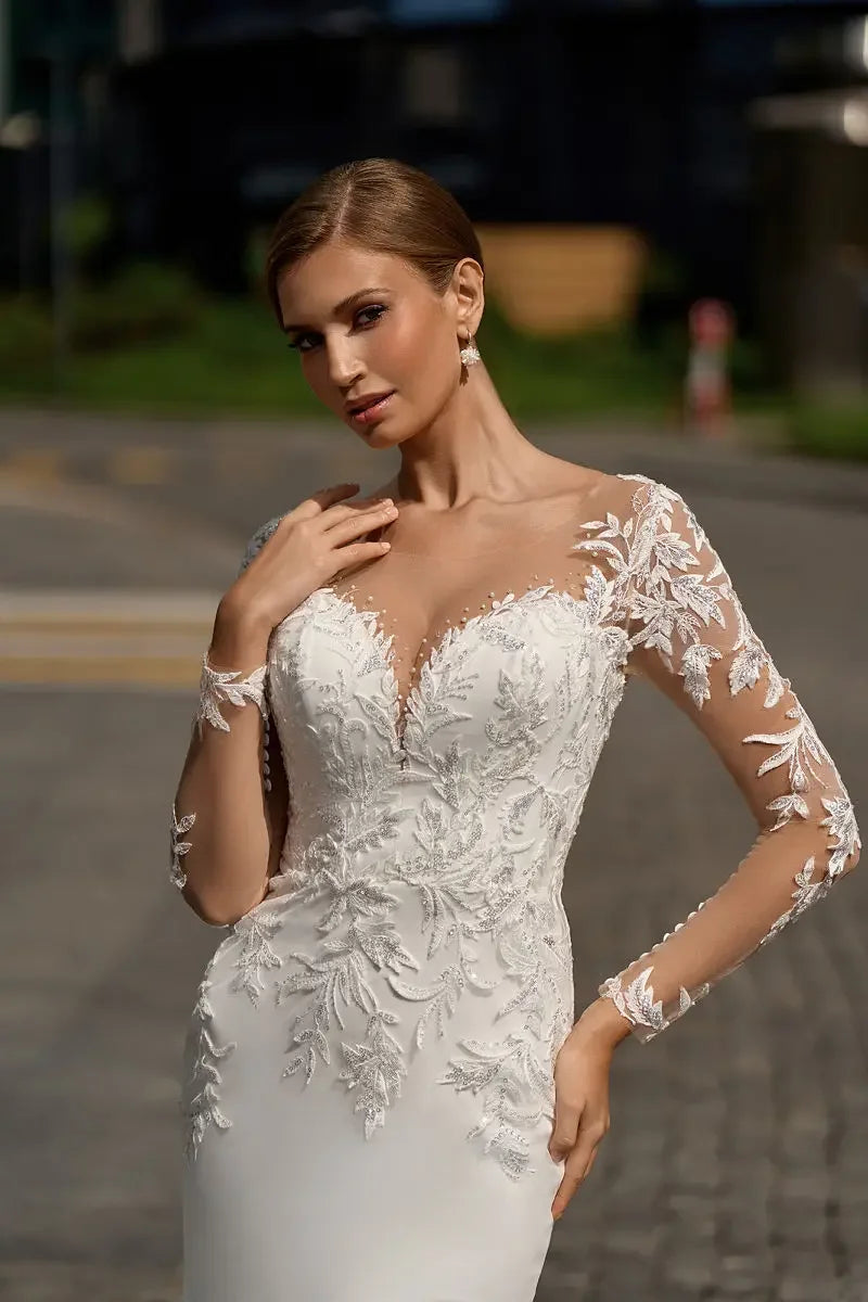 V-neck lace sweep train button mermaid beach long sleeve wedding dress front view