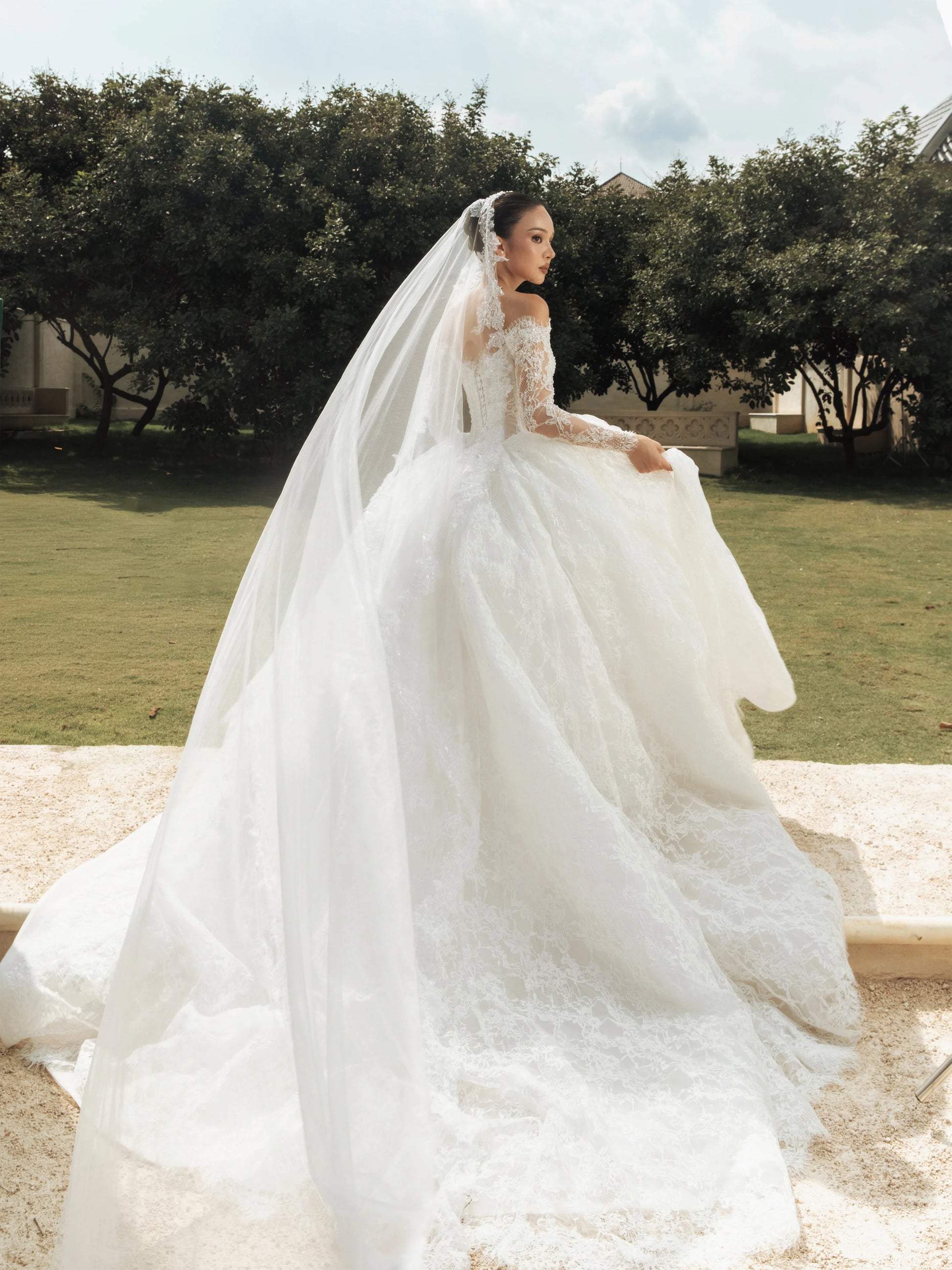 Off-shoulder long sleeve A-line lace wedding dress – train view – Snowy Bridal