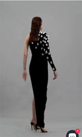 Woman elegant black one shoulder shining diamonds long bandage evening red carpet party dress close-up