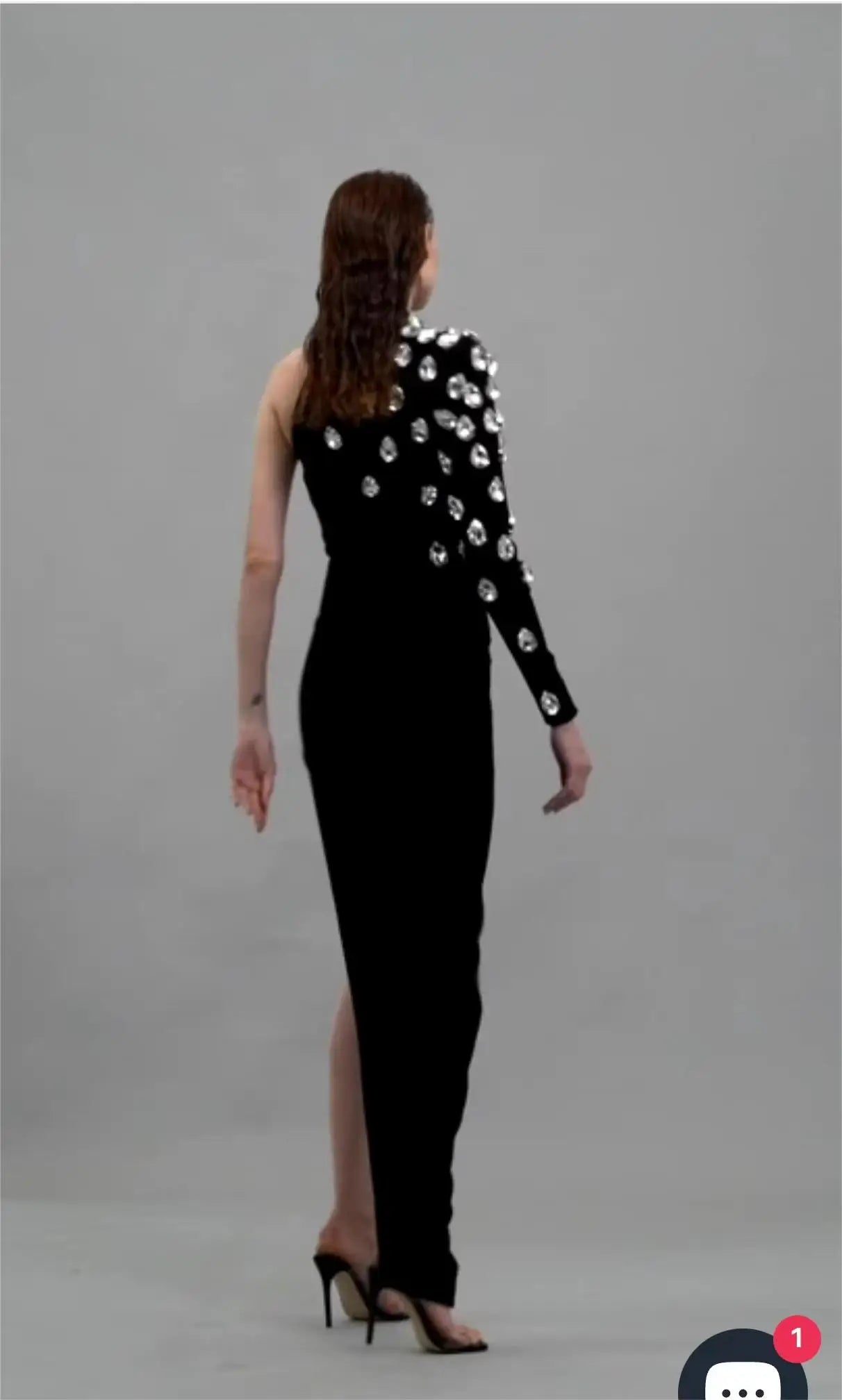 Woman elegant black one shoulder shining diamonds long bandage evening red carpet party dress close-up