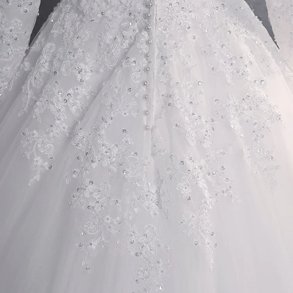 Modest wedding dress 2026 lace beads long sleeves high neck with train princess A-line bridal gown