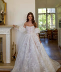 Strapless A-line lace wedding dress with puff sleeves – front view – Snowy Bridal