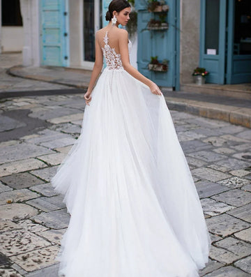 Elegant long sheer tulle white illusion back court train bridal gown front view