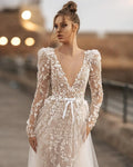 Long sleeve V-neck luxury elegant A-line beach halterback bridal dress back view