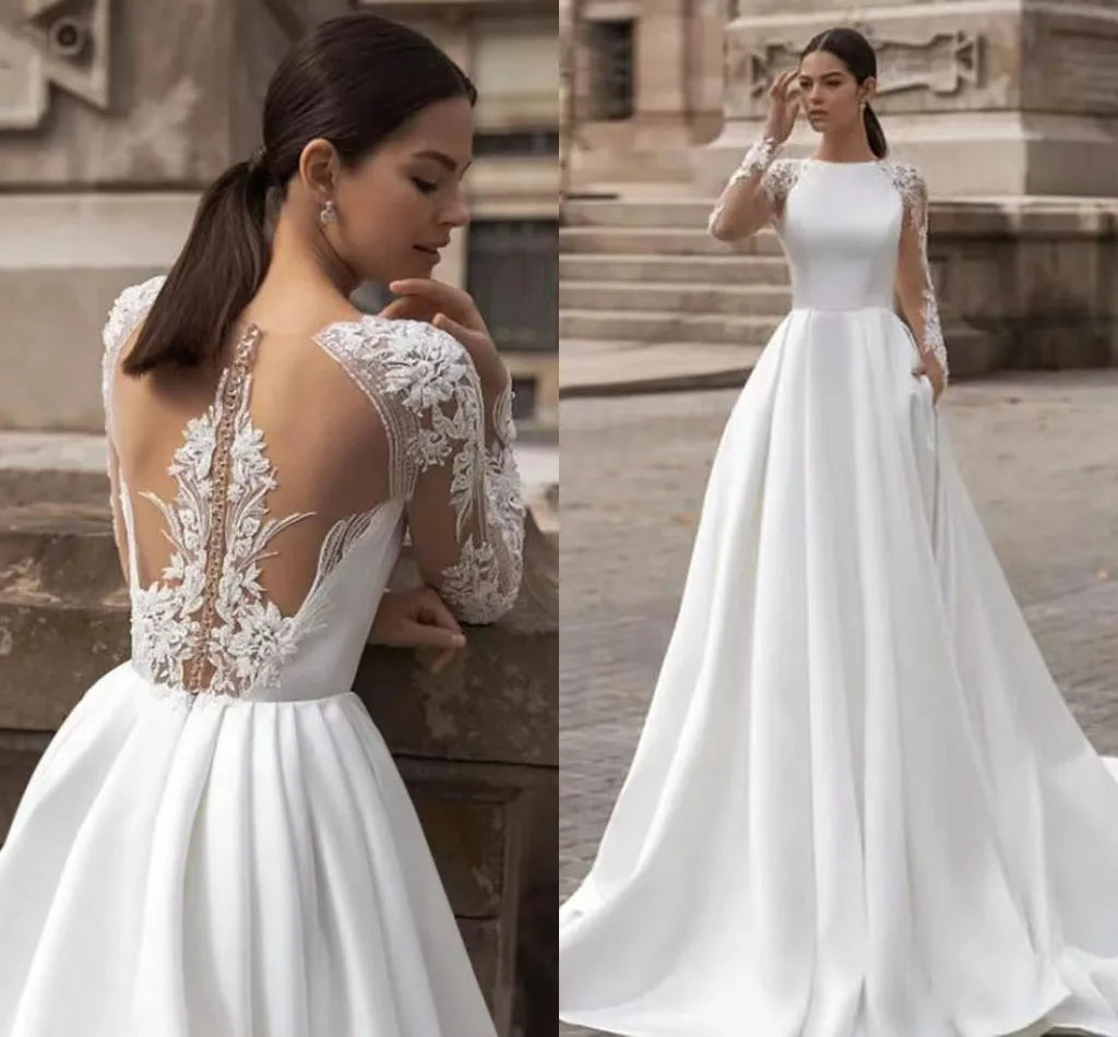 Exquisite A-line wedding dress 2026 boat neck long sleeves illusion back buttons embroidery lace bridal gown