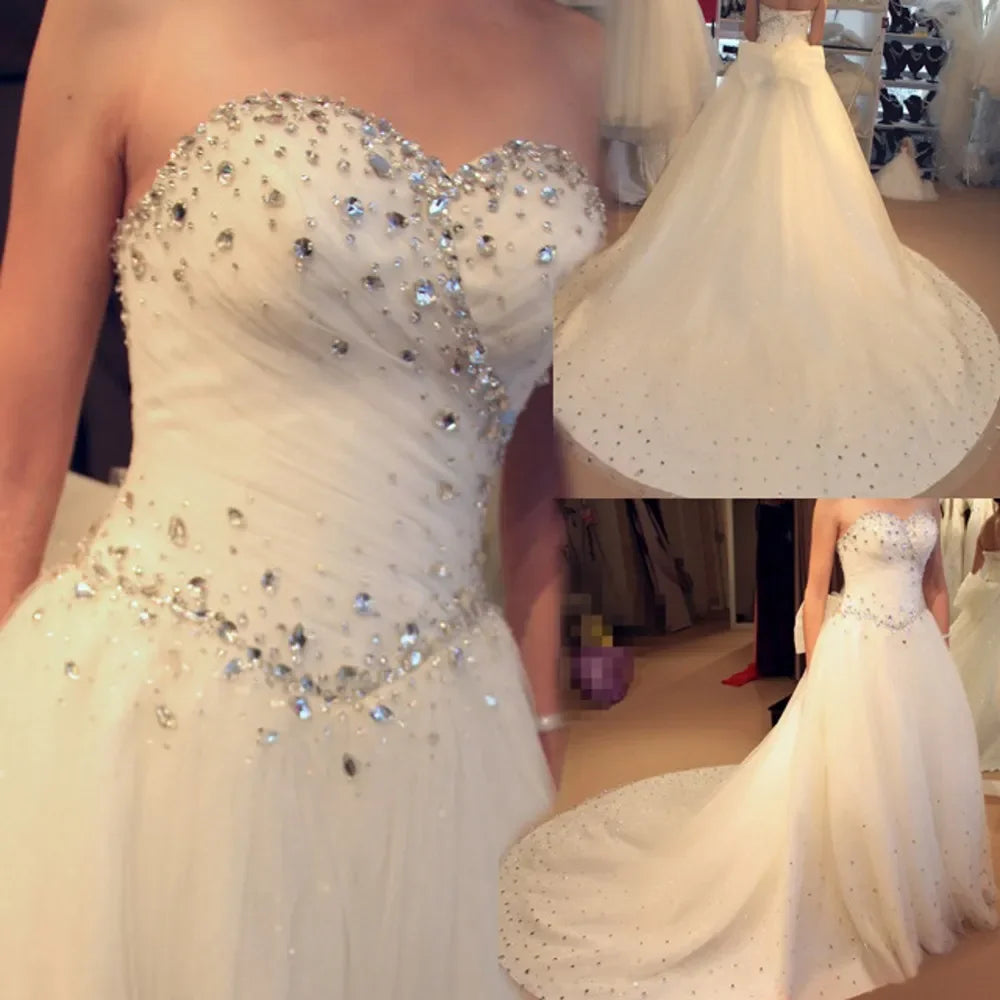 Elegant A-line wedding dress 2026 sweetheart crystal beads court train tulle princess bridal gown