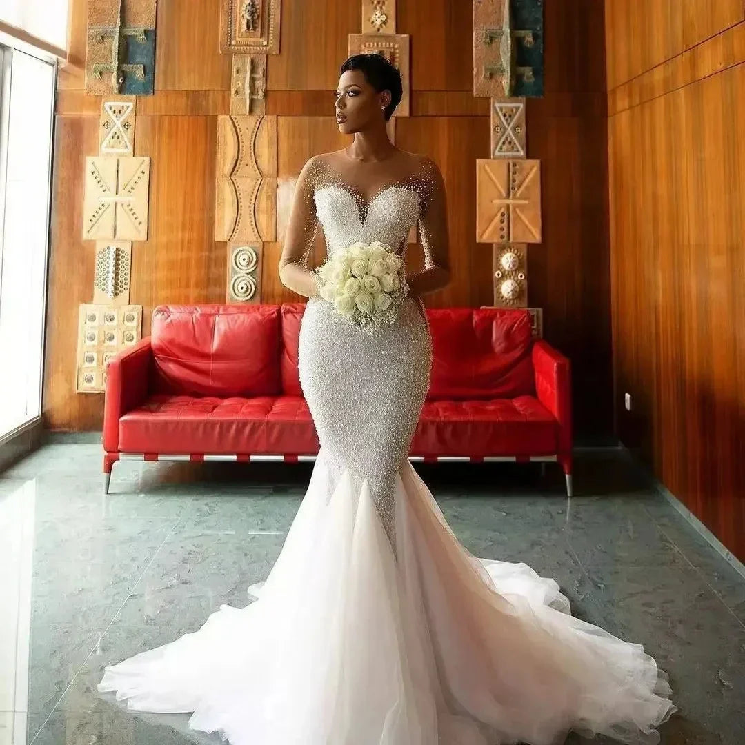 Sexy mermaid wedding dress 2026 sheer sweetheart long illusion sleeves pearls sequined tulle bridal gown