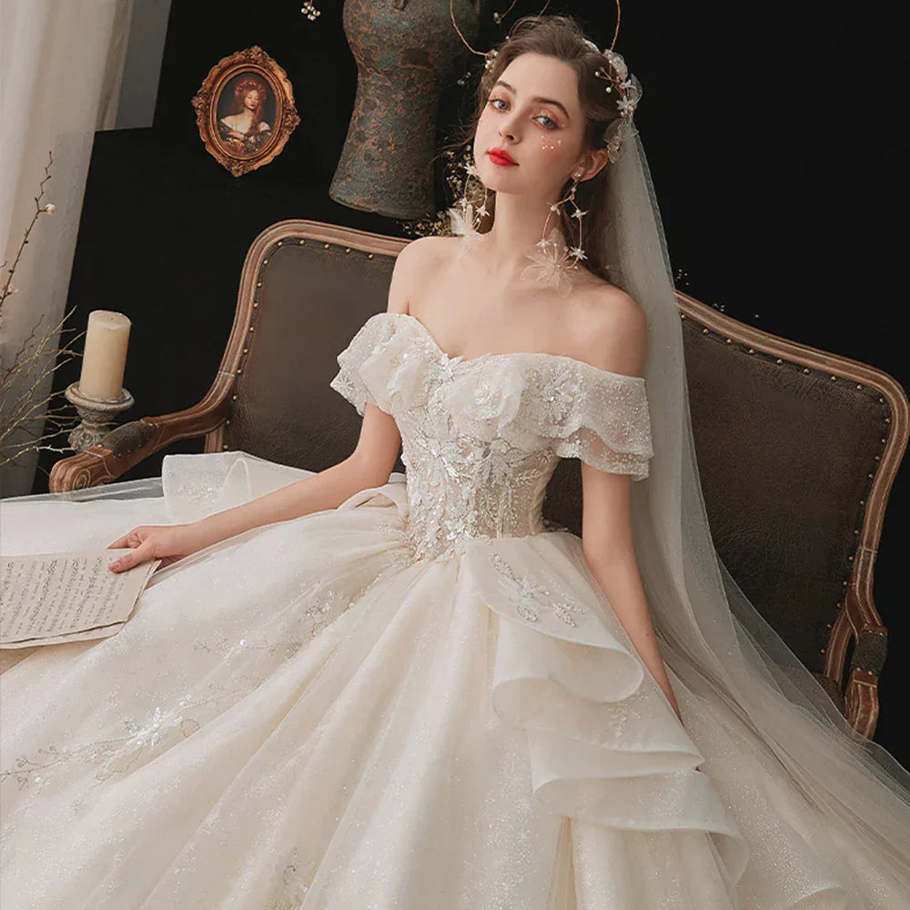Princess long train ball gown off-shoulder crystal beading sparkly lace-up short sleeve wedding dress back