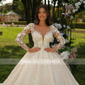 Long sleeve scalloped embroidery elegant princess ball gown appliques wedding dress back view